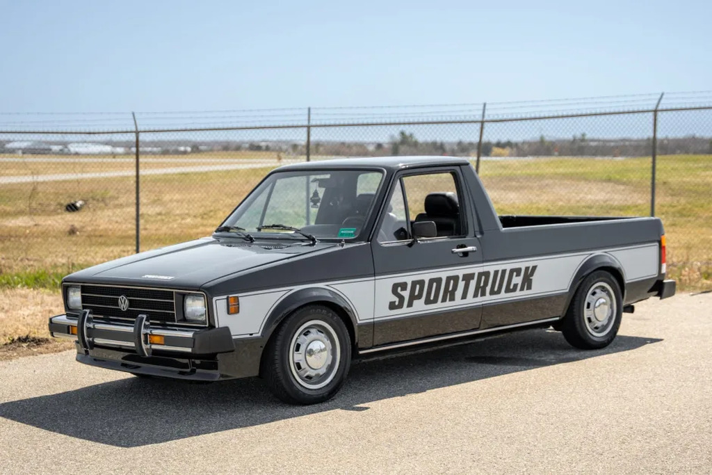 AI caption: a pickup truck with the word sporttruck on it, black and white