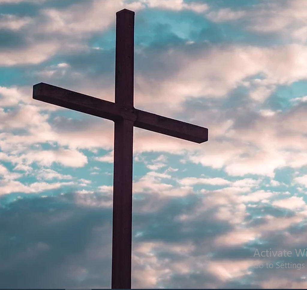 AI caption: a cross is shown against a cloudy sky, abstract