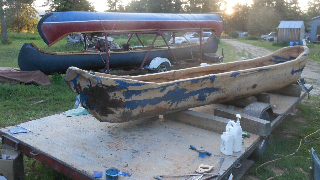 AI caption: a canoe is being built on a wooden platform, a canoe