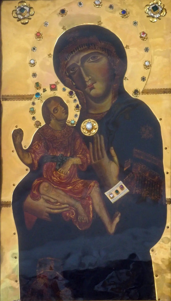 AI caption: a gold and black icon of the virgin and child, russian icon