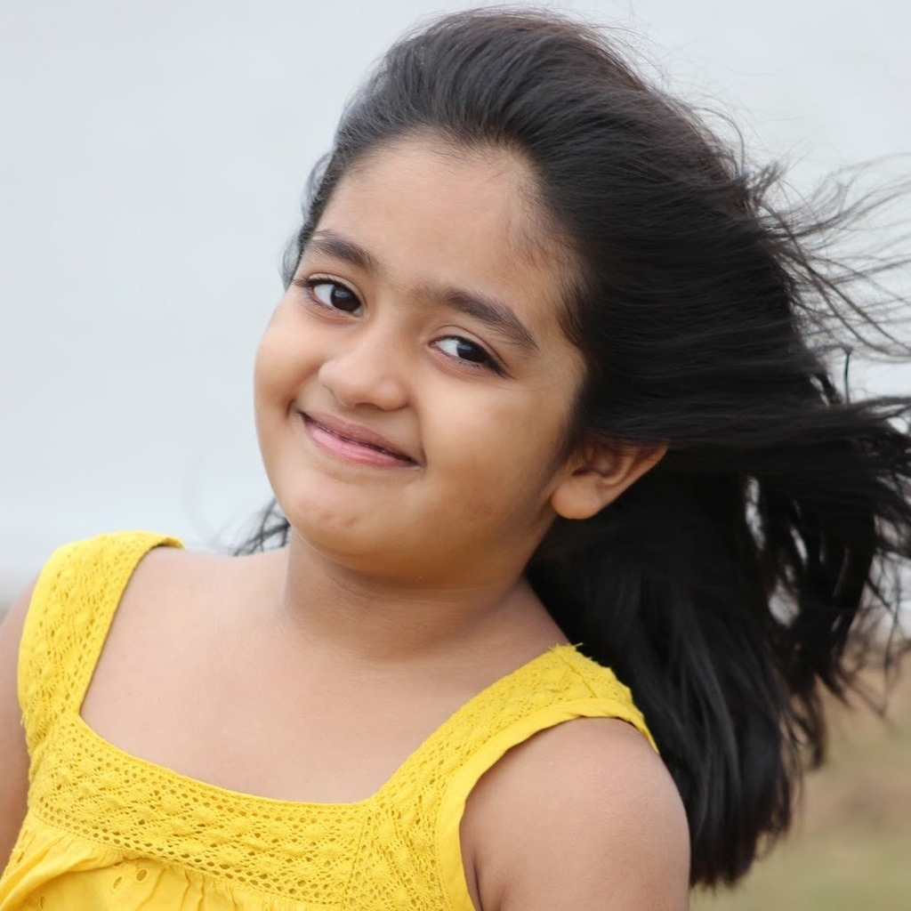 AI caption: a girl in a colorful dress leaning against a wall, portrait a young girl in yellow dress smiling